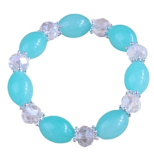 Elegant beaded bracelet with aqua green and clear faceted resin stones on white background