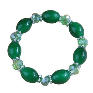 Elegant green beaded bracelet with smooth oval resin and faceted crystal beads with silver spacers