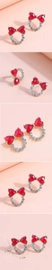 Vues détaillées de boucles d'oreilles nœud rouge avec strass et dimensions précises