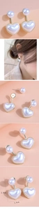 Vue détaillée des boucles d'oreilles perles en cœur avec cadre doré et dimensions 2,8cm