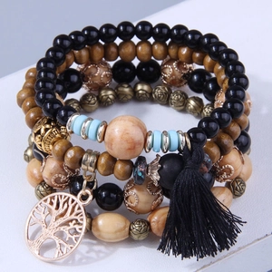 Detail of Bohemian multilayer beaded bracelet with Tree of Life charm and black tassel