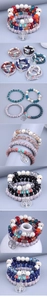 Close-up of Bohemian multi-layer stretch bracelets with tree of life and butterfly charms