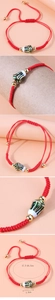 Detail of red woven bracelet with green tulip bead and 17.5-26.5cm adjustable length