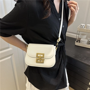 Minimalist white saddle crossbody bag with golden geometric buckle for women in 2025