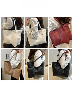 Model showcasing various colors of large woven texture tote bags with matching inner pouches