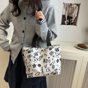 Large white tote bag with black cartoon graffiti prints and durable shoulder straps