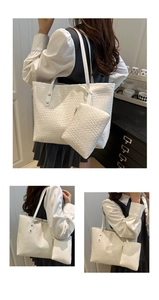 Detail of white woven tote bag texture with matching mini pouch and metal rivets