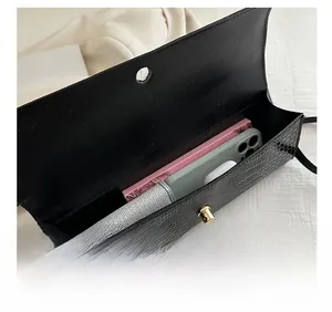 Internal capacity of the crocodile pattern baguette bag showing space for a phone and wallet