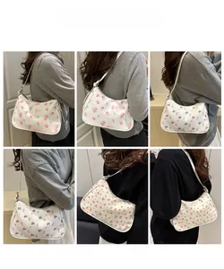 Collage of model wearing floral underarm bags with rose and cherry print patterns