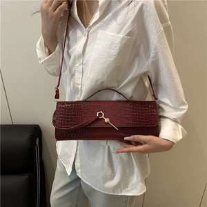 Elegant wine red crocodile pattern baguette handbag with golden buckle and top handle