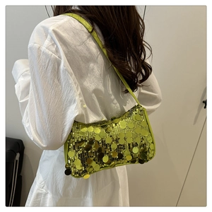 Back view of neon green sequin shoulder bag on model showing Y2K fashion style