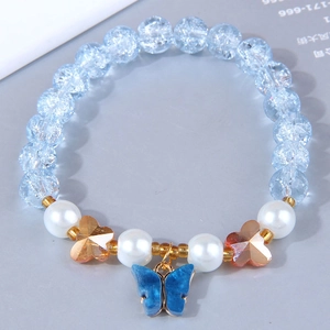 Detail of sweet butterfly pendant bracelet with light blue crackle beads and pearls