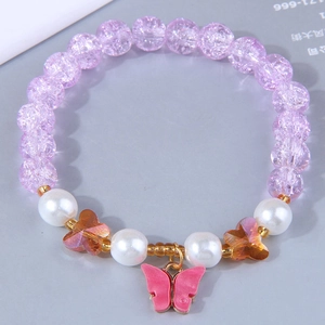 Macro view of purple crackle beads bracelet with pink butterfly charm and pearls