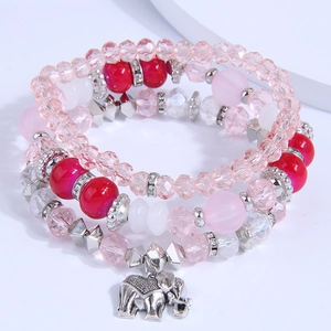 Multilayer beaded bracelet featuring pink crystal beads and a silver elephant pendant