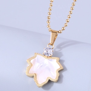 Golden maple leaf pendant necklace with mother-of-pearl inlay and bead chain