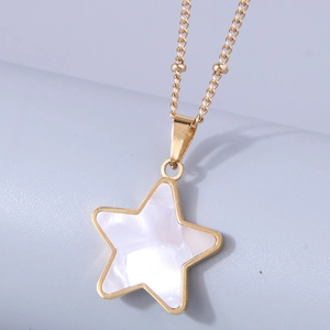 Minimalist gold star pendant necklace with iridescent mother of pearl inlay on blue background