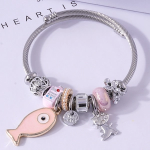 Chic multi-charm wire bracelet featuring pink fish, crystal beads and handmade engraving