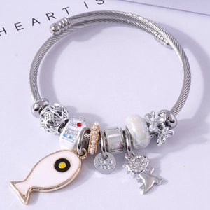 Silver twisted bangle with enamel fish charm, handmade tag and colorful DIY beads