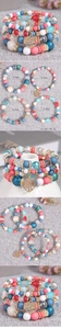 Detailed view of bohemian multilayer bead bracelets with a golden heart tree charm