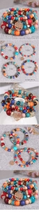 Detail view of multi-layer beaded bracelet set with tree of life heart pendant