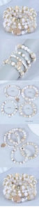 Detail of 4-piece layered bead bracelet set featuring tree of life heart pendant