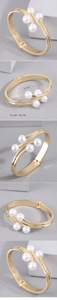 Detail view of gold double-row pearl bracelet showing dimensions 6.2cm and 0.9cm