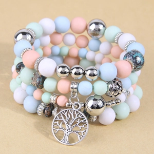 Multi-layer pastel bead bracelet featuring a tree of life pendant and silver accents