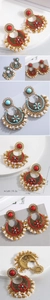 Detail view of Bohemian crescent earrings with red stones and pearls, 6.7cm x 4.8cm