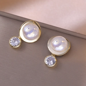 Elegant gold earrings featuring a large iridescent gem paired with a sparkling zircon stone
