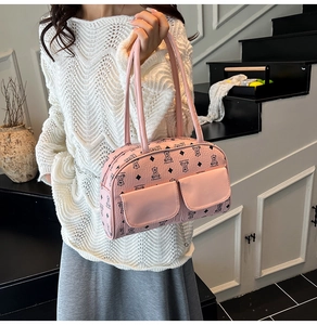 Pink vintage hobo bag featuring teddy bear prints and dual front flap pockets