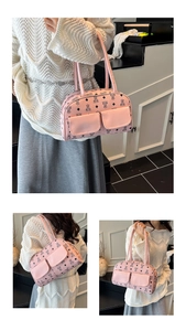 Detailed view of pink Boston bag with bear monogram print and front flap pockets