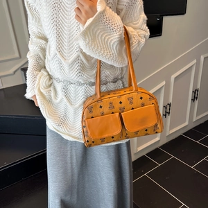 Tan boston shoulder bag with bear pattern print and front pockets in chic retro style