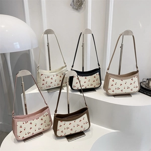 Chic cherry print baguette bag in five colors on display with stylish 2025 trendy design