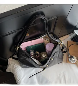 Internal view of the large black tote bag showing spacious storage for daily items
