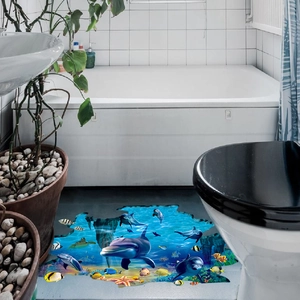3D ocean floor sticker showing leaping dolphins and coral reef in a bathroom setting
