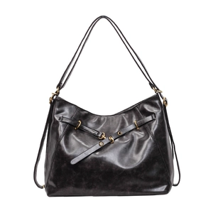 Retro black leather hobo tote bag with polished metal buckle and belt detail