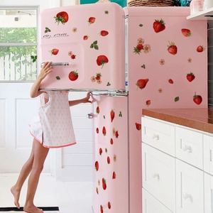 Detailed strawberry and floral wall decals applied on a retro pink refrigerator