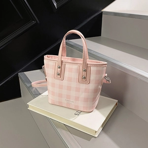 Pink and white gingham mini bucket bag with silver rivets and thin shoulder strap