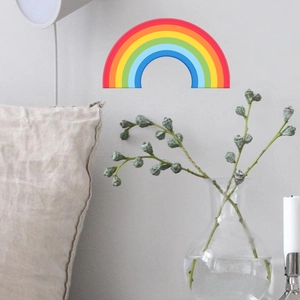 Luminous mini rainbow wall sticker for children room decoration on a neutral wall surface