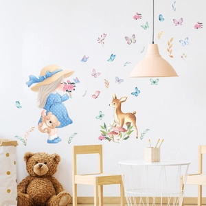 Cartoon girl and deer wall stickers in a cozy nursery setting with macaron tones