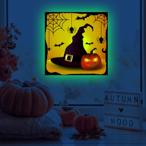 Glow-in-the-dark Halloween wall sticker featuring a purple witch hat and pumpkin design