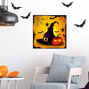 Detailed view of luminous Halloween wall sticker with witch hat and pumpkin on grey wall