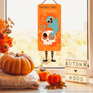 Close-up of Halloween Spooky Time hanging decor with ghost and skull on autumn windowsill