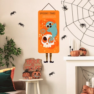 Halloween wall hanging decor with spooky ghost and witch legs in a festive home setup