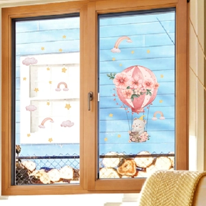 Detailed view of cartoon elephant hot air balloon window sticker on wooden frame glass