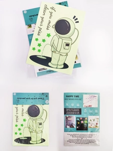 Luminous astronaut toilet lid sticker with funny quote in clear retail packaging