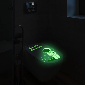 Luminous astronaut toilet lid sticker glowing in dark with funny quote and small stars