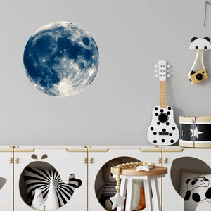 Detailed realistic blue moon wall decal with crater texture in a cozy children's room