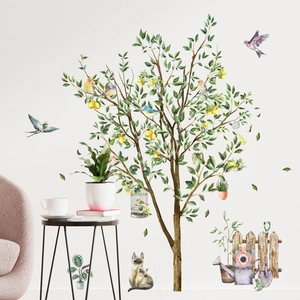 Detail of lemon tree wall sticker with birds and cats in a cozy living room setting