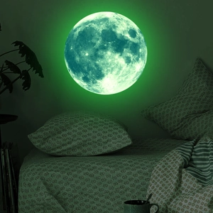 Luminous green moon wall sticker glowing in dark bedroom for astronomical room decor
